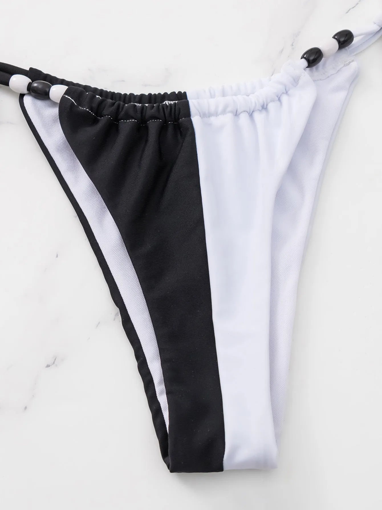 Black and white women's lace-up triangle cup bikini with briefs