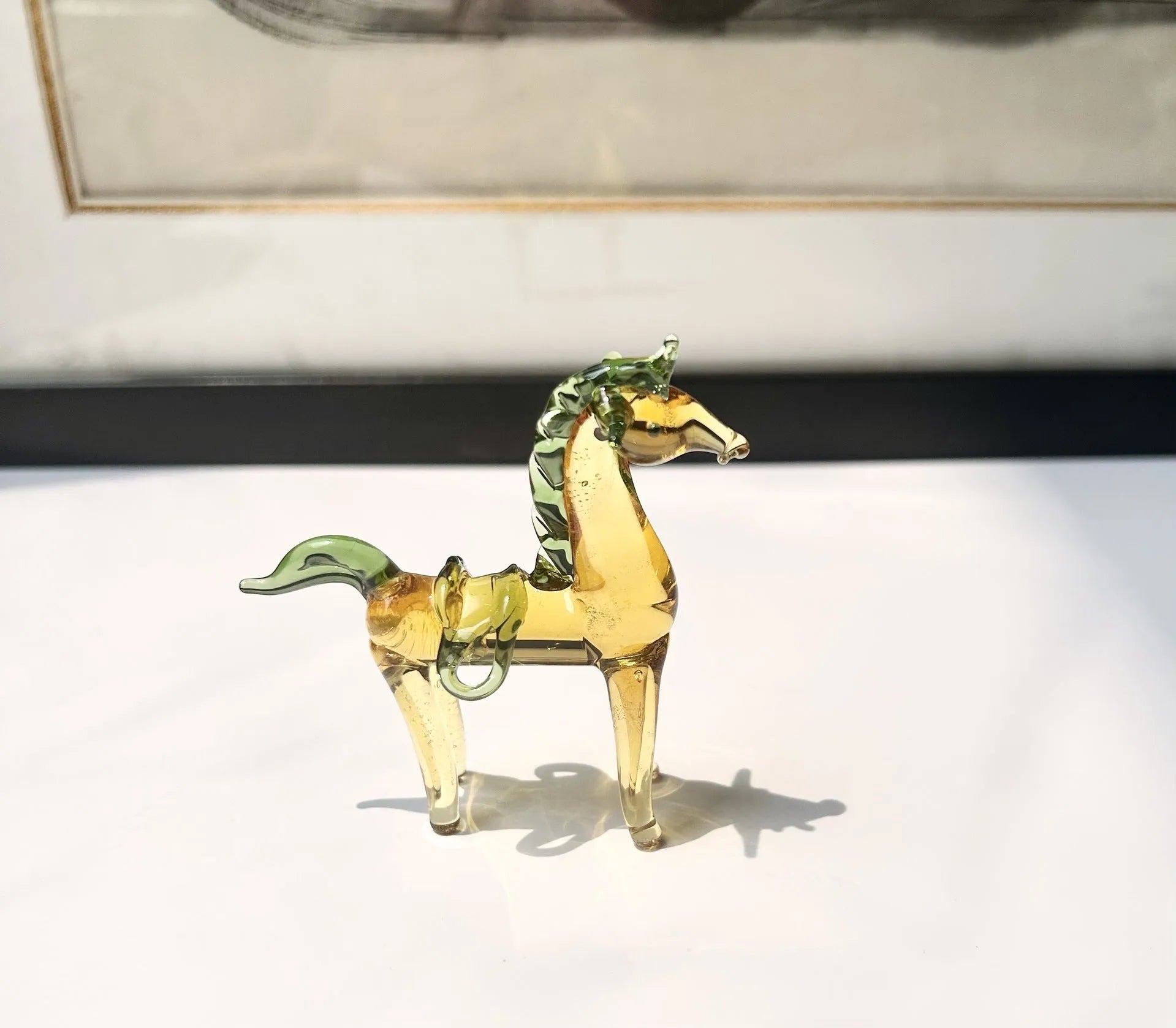 Brown glazed horse decoration on wooden desk with modern minimalist design and glossy finish