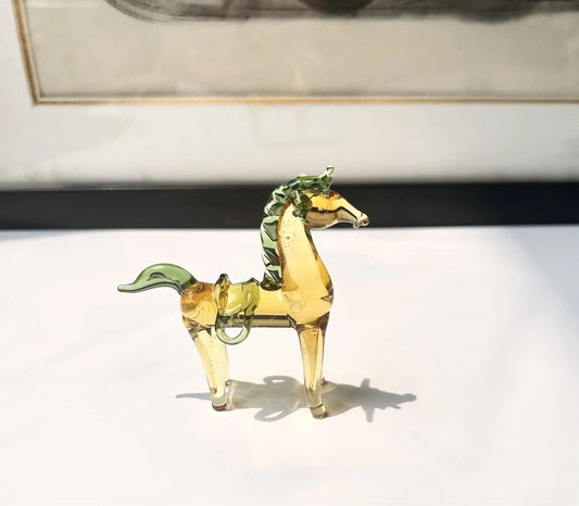 Brown glazed horse decoration on wooden desk with modern minimalist design and glossy finish