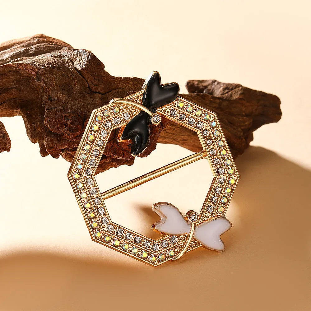 Bow-shaped waist-cinching accessory clip for high-end brooches, alloy with electroplating and diamond inlay, shown in gold, silver, or rose gold finishes.