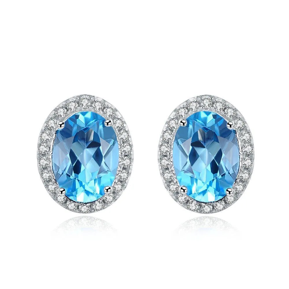 925 sterling silver jewellery set with blue topaz gemstones in geometry pattern, including earrings, ring, pendant, and necklace