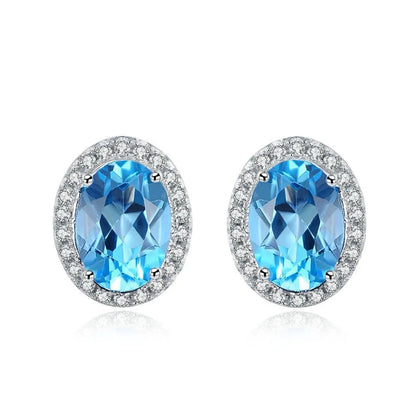 925 sterling silver jewellery set with blue topaz gemstones in geometry pattern, including earrings, ring, pendant, and necklace