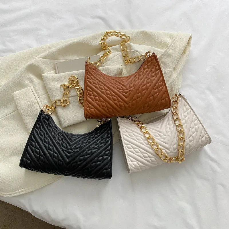 Brown pleated chain baguette shoulder underarm bag with adjustable strap and soft carry handle