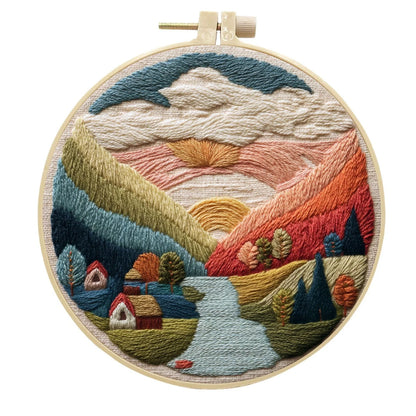 Embroidery DIY landscape kit with bamboo frame, printed fabric, thread, and needles for textile art
