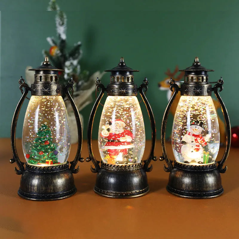Crystal ball Christmas decoration with LED-lit paper snowman and elderly figures on desktop
