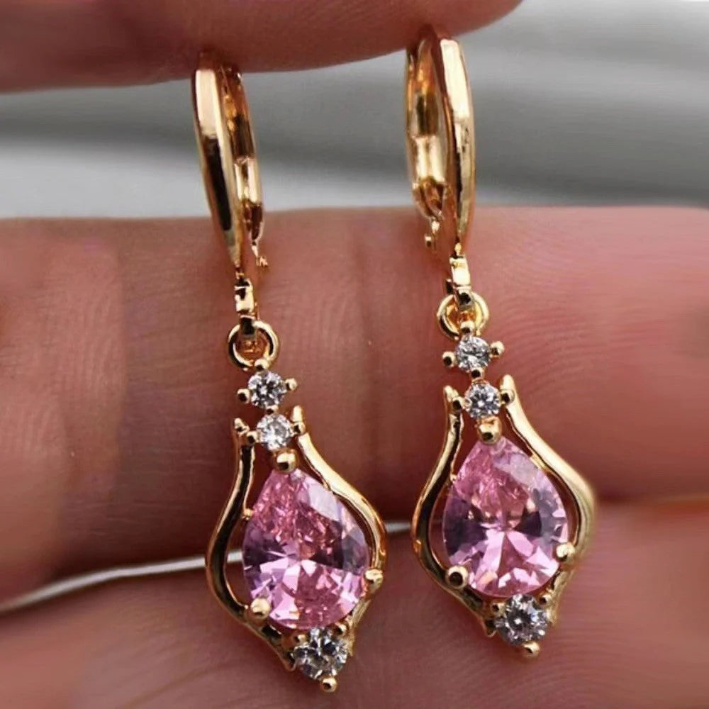Elegant drop-shaped earrings with shimmering zircon accents in various colors, including purple, white, red, pink, and champagne
