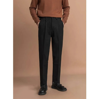 Man wearing straight cut draped polyester casual trousers in dark grey