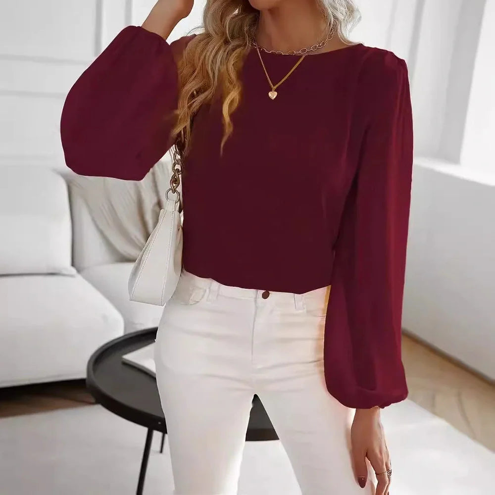 Wine red polyester long sleeve pullover top with button detailing on front, regular fit for commuting wear