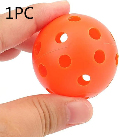 Multi-colour golf practice balls in red, orange, blue, green, white, and yellow, 42mm diameter, packed in a net pocket