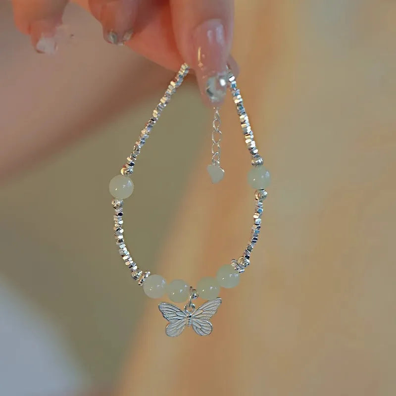 Hetian jade silver butterfly bracelet necklace set for women with electroplated copper construction featuring a butterfly charm design, this jewellery combination provides a two-piece accessory option suitable for female wearers seeking a niche style.