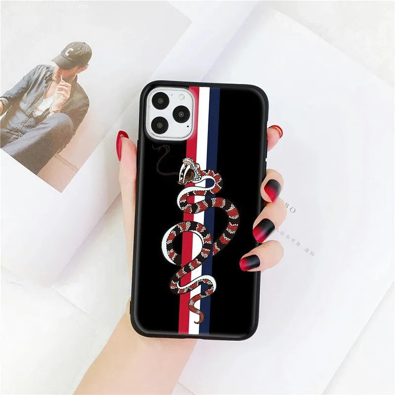 Black frosted silicone iPhone case with a UV-printed cartoon snake design on the back.