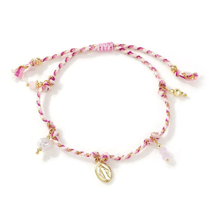 Close-up of a colourful hand-woven braided rope bracelet for women, showing ethnic strap design.
