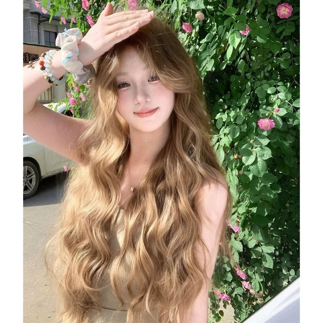 Medium length synthetic wig with linen coloured long curly hair style and hair net
