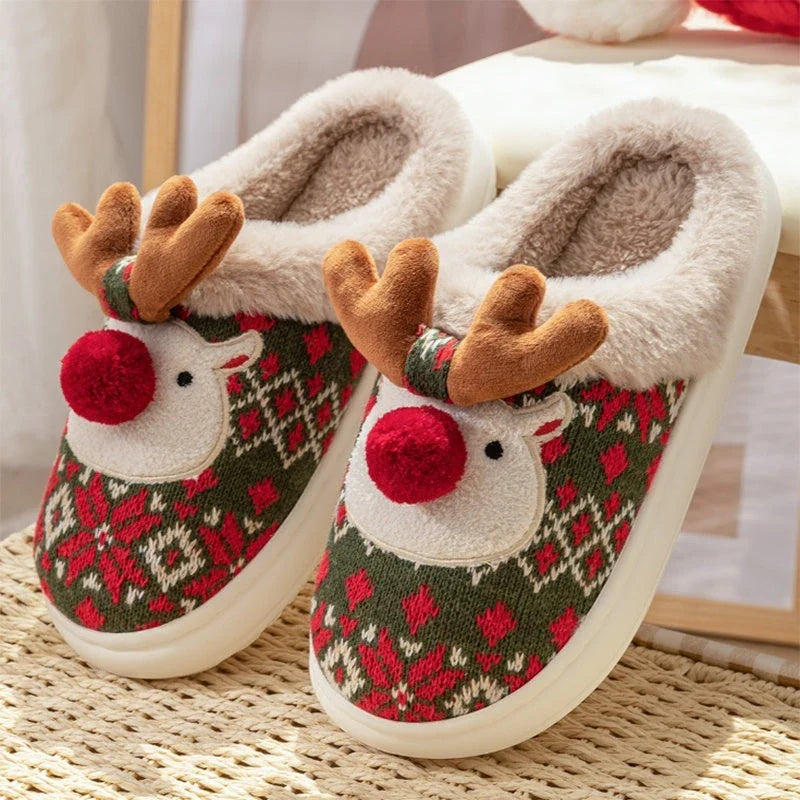 Cozy elk-inspired plush slippers in festive Christmas green and red colors, featuring a soft, comfortable upper and non-slip soles for indoor wear