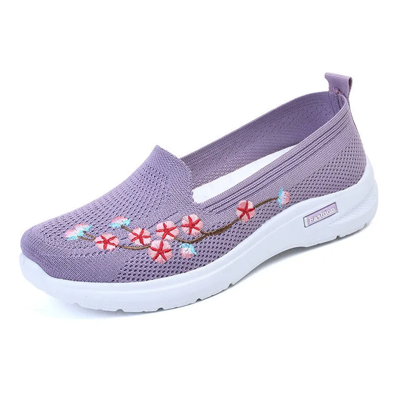 Women's low-top embroidered fly knit sports pumps in wine red with anti-slip sole.