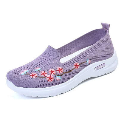 Women's low-top embroidered fly knit sports pumps in wine red with anti-slip sole.
