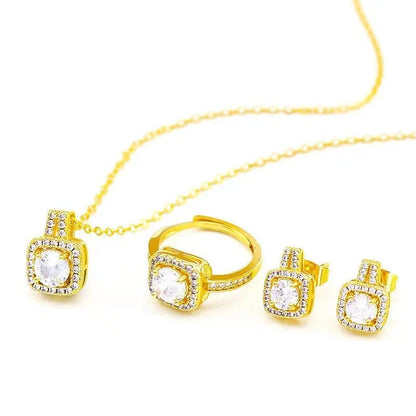 Elegant gold-toned jewelry set including necklace, earrings, and ring with zircon gemstone pendant