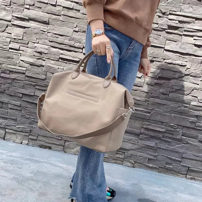 Nylon waterproof cloth shoulder bag with leather details in black or light khaki colour, 35x14x27cm dimensions