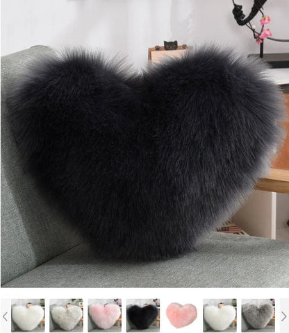 Cozy heart-shaped plush throw pillows in various colors and sizes for living room and bedroom decor