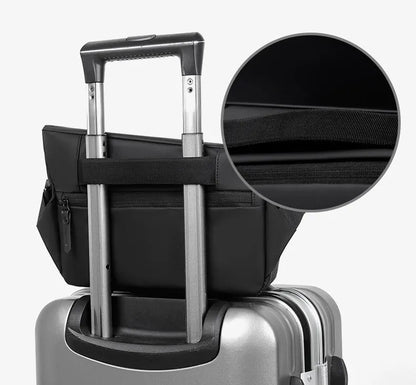 Grey crossbody bag with single shoulder strap showing zipper opening and internal organisation pockets