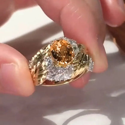 Gold colour copper ring with embossed feather pattern and inlaid yellow zircon, showing geometric shape and detailed texture