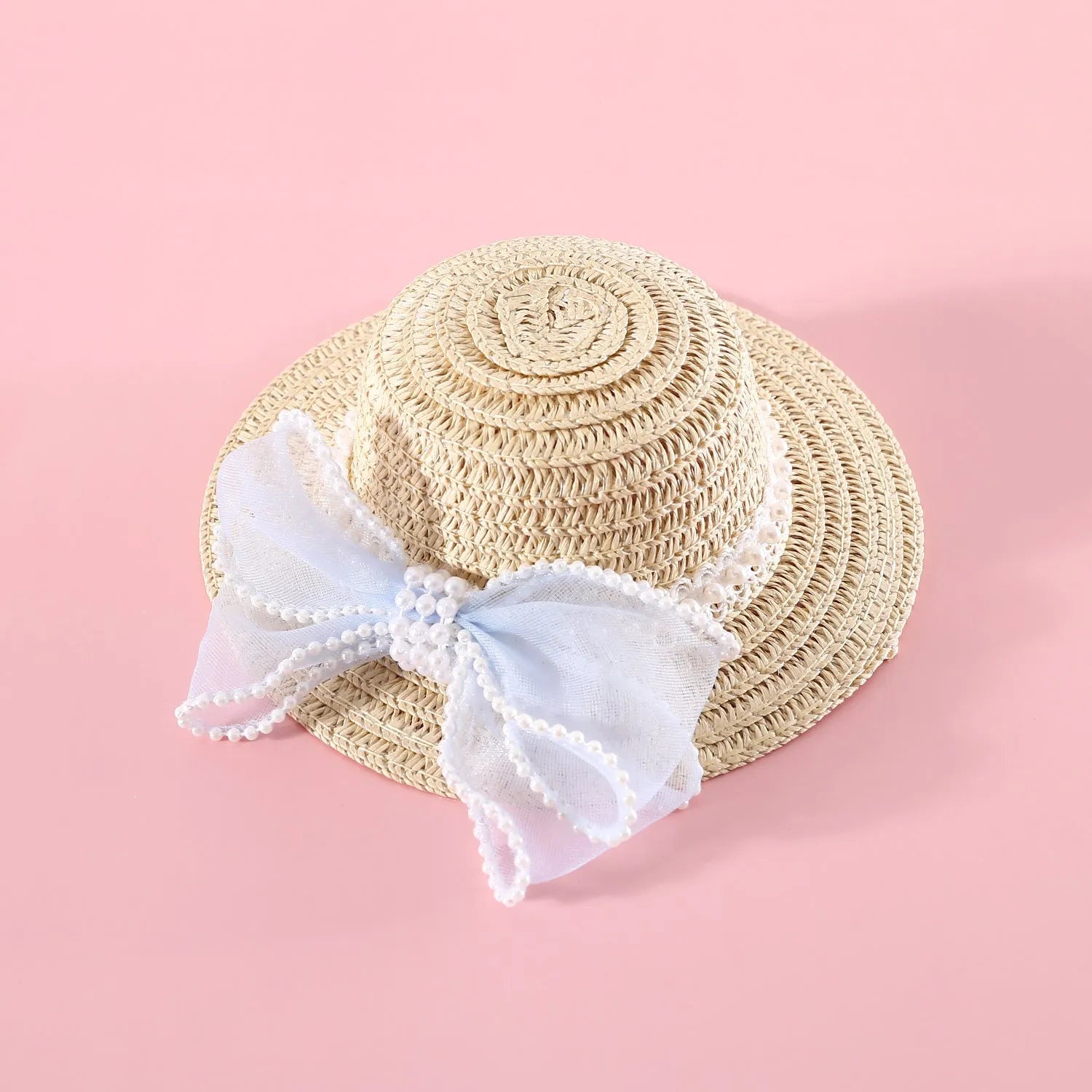 A woven Lafite leaf hat for cats with a pearl butterfly bow, shown in pink, purple, blue, and white colour options.