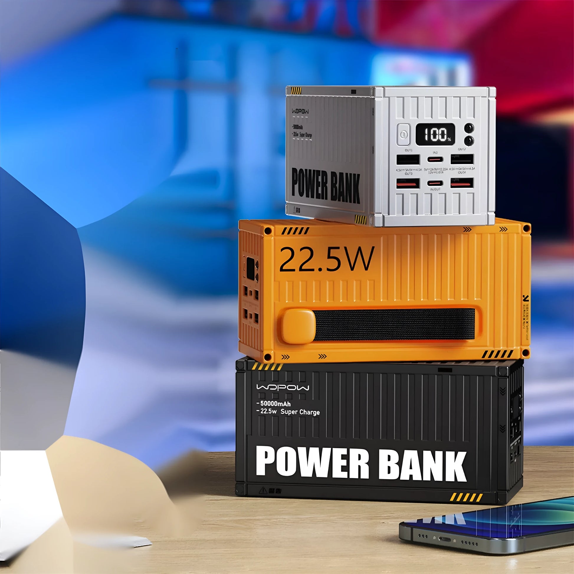 Yellow 50000mAh portable power bank with digital display showing battery percentage and multiple USB ports.