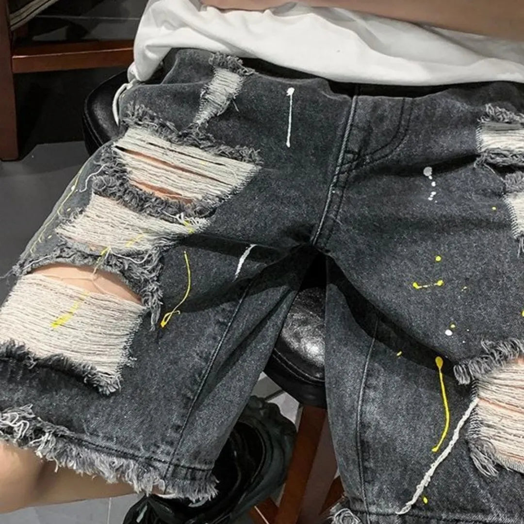 Men's loose-fit light blue denim shorts with a water-washed finish and fifth-pants length on a plain background.