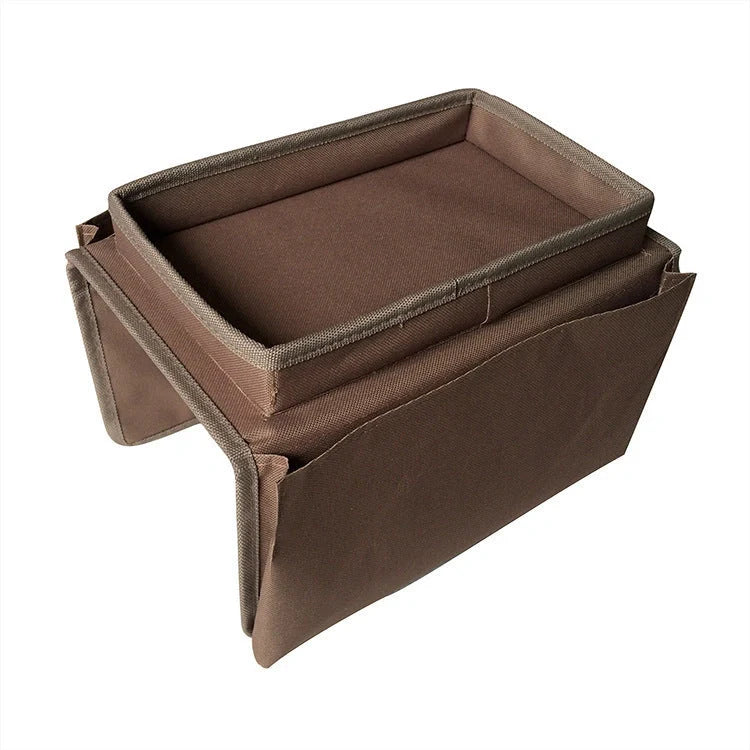 Sofa arm organizer bag in black with multiple pockets for remote controls and magazines