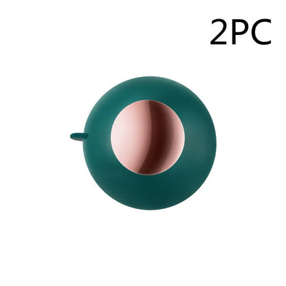 Green Gold reusable gel lint roller ball for removing pet hair from fabrics.