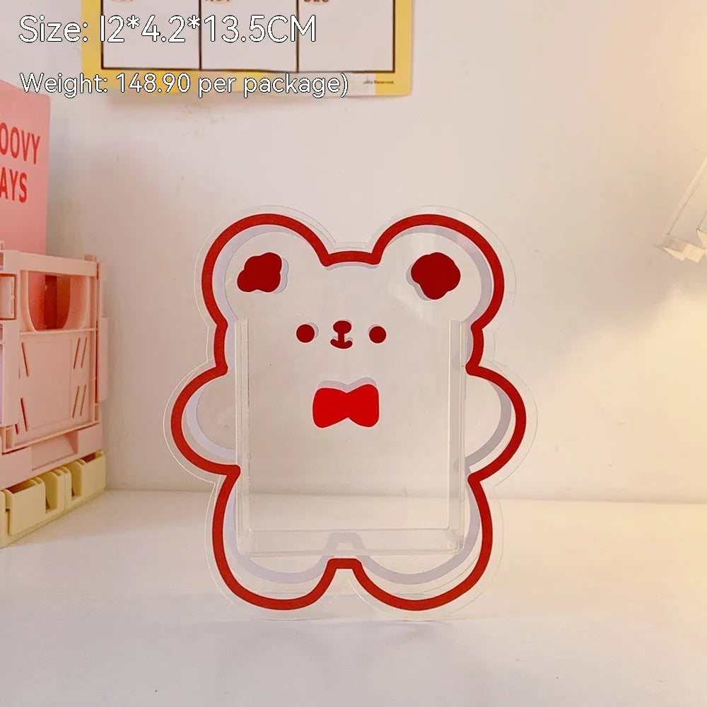 Square transparent acrylic storage box with printed character theme containing coloured pens