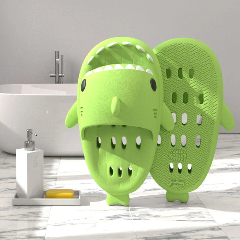 Colorful shark-themed shower slides with drainage holes, designed for comfortable and practical use in the pool or shower.