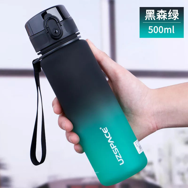 Large capacity Tritan sports water bottle in vibrant colors, perfect for hydration on the go