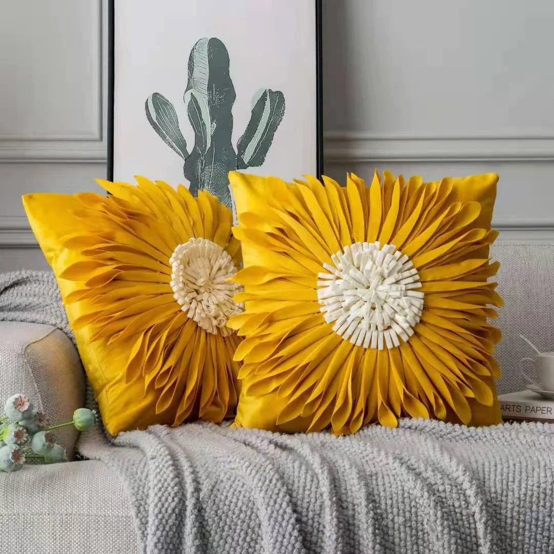 Stylish velvet throw pillows with 3D chrysanthemum embellishments in blue, yellow, pink, and white colors