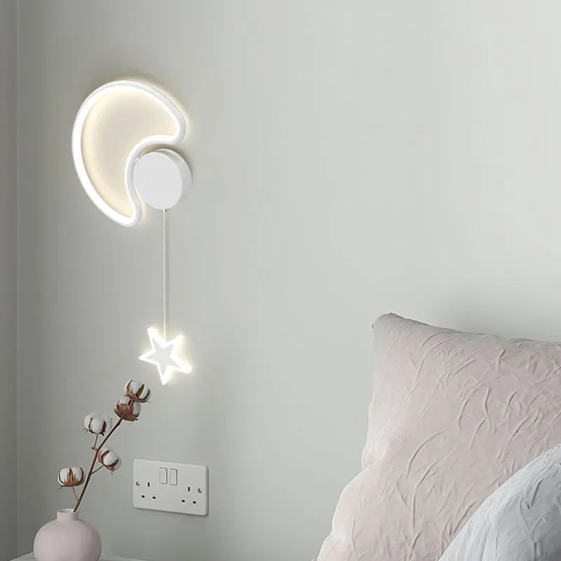 Black five-pointed star shaped children's wall lamp with a left-facing cloud design and touch control for three colour LED light.
