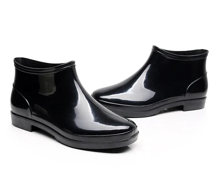 Black short-tube men's rain boots with non-slip plastic sole and PVC upper, sizes 36-50.
