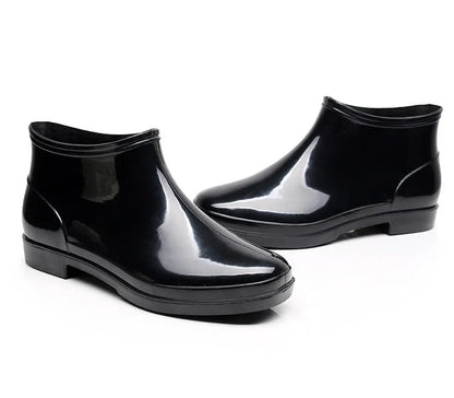 Black short-tube men's rain boots with non-slip plastic sole and PVC upper, sizes 36-50.