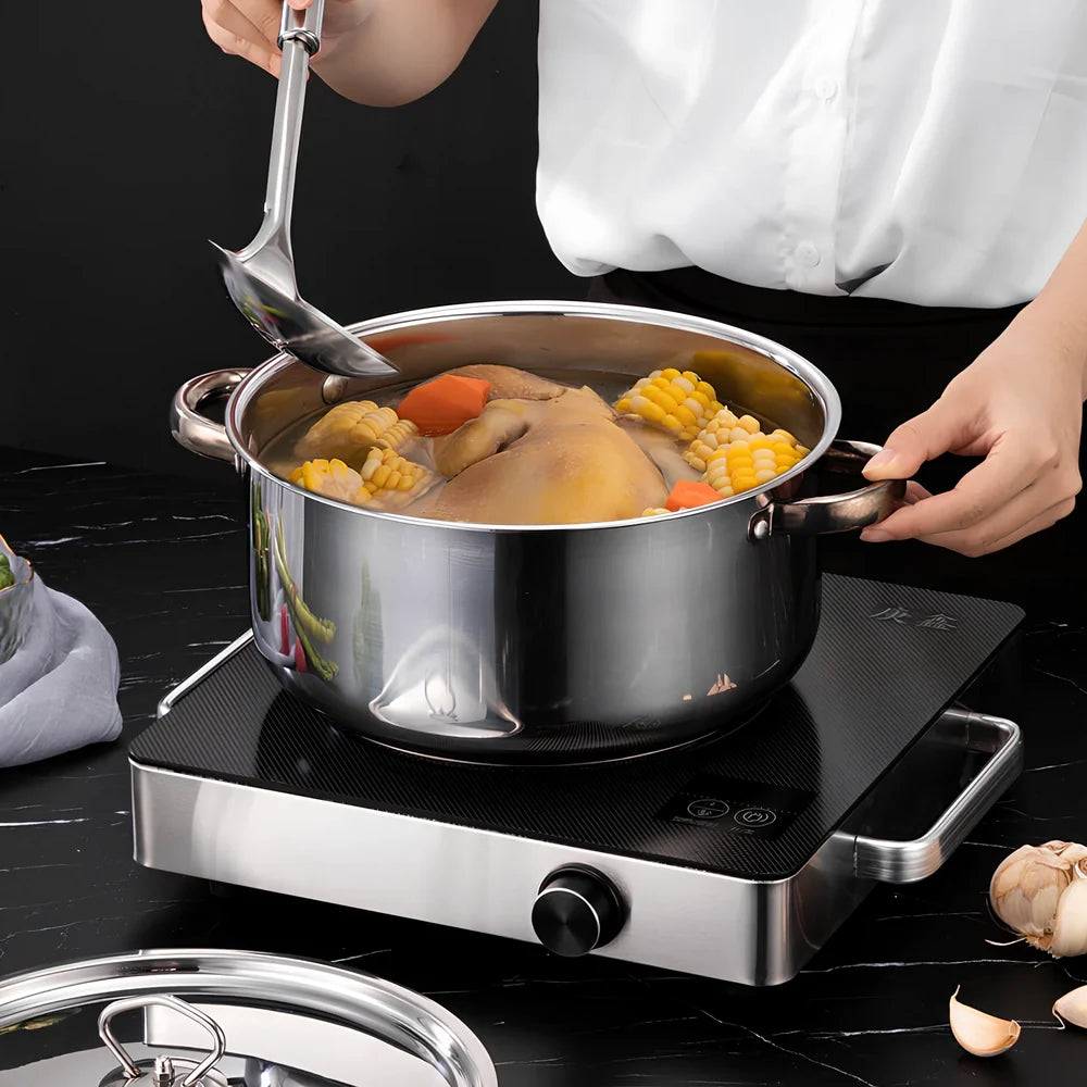 Stainless steel cookware set with 12 pots, glass lids, and utensils in compact 45cm storage package