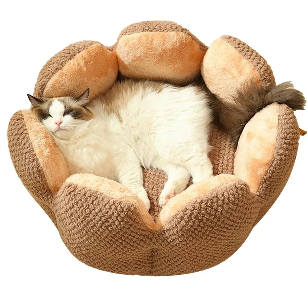Green cactus petal shape pet bed for cats and dogs on a hardwood floor.