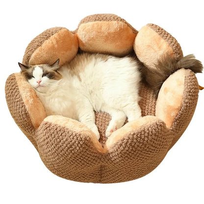 Green cactus petal shape pet bed for cats and dogs on a hardwood floor.
