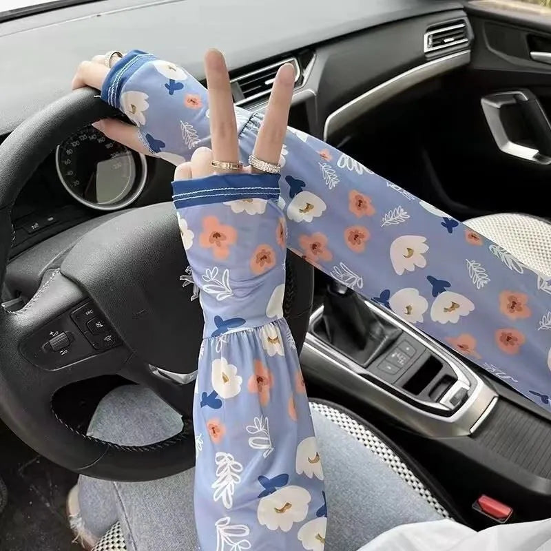 UV protection ice silk oversleeves in floral pattern covering forearm and elbow