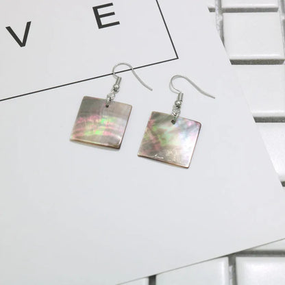 Natural shell earrings in geometric square and rectangular shapes with panther pattern detailing