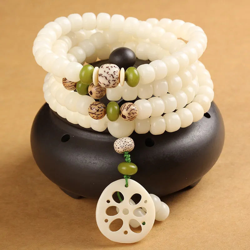 A long white jade Bodhi bead bracelet with 6x8mm beads, shown in various style options including cloisonne and lotus designs.