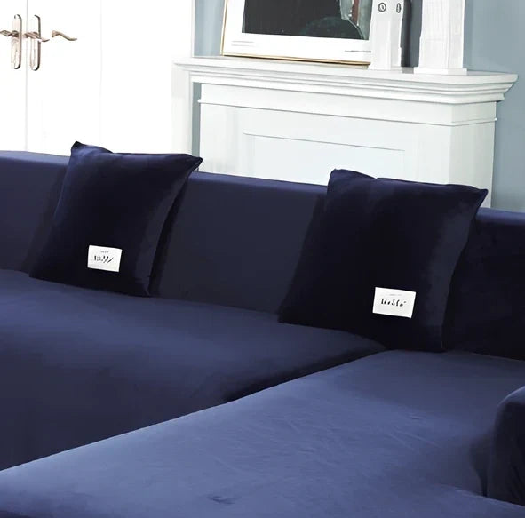 Silver Fox Velvet elastic sofa cover stretched over grey sofa showing fitted appearance