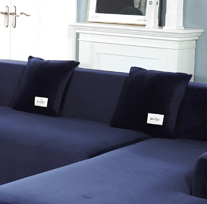 Silver Fox Velvet elastic sofa cover stretched over grey sofa showing fitted appearance