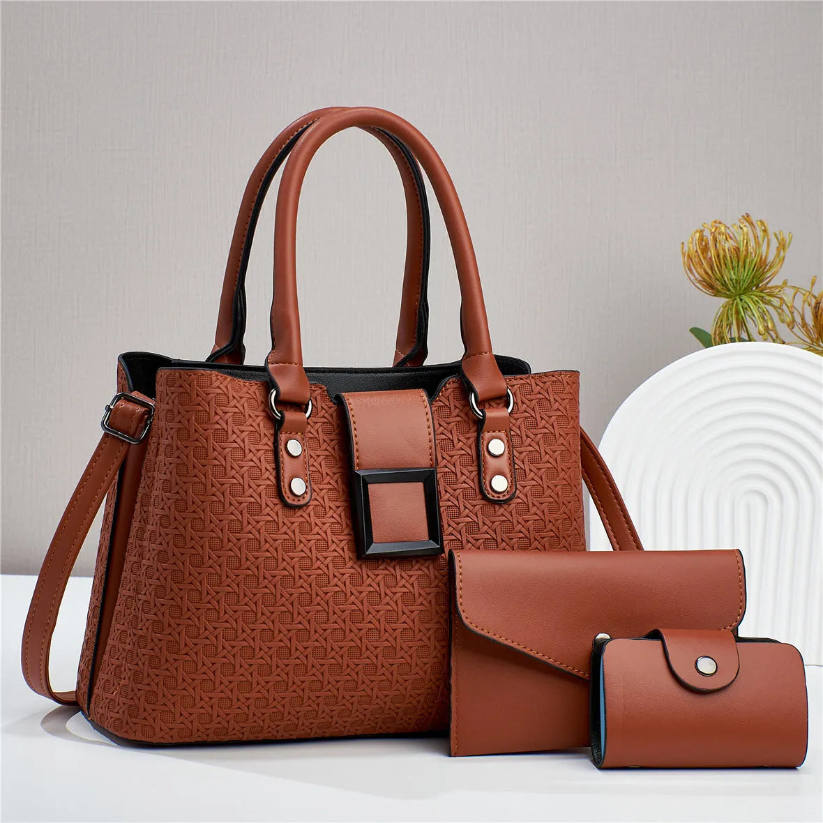 Textured PU leather three-piece women's crossbody bag in a square vertical shape, shown in apricot colour.