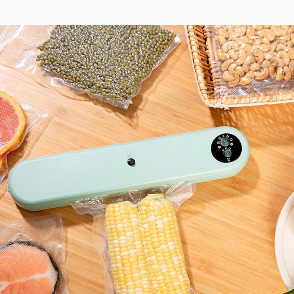 Green compact vacuum sealing machine, 32x7.5x5cm size, 110W power for food preservation with -50kPa pressure