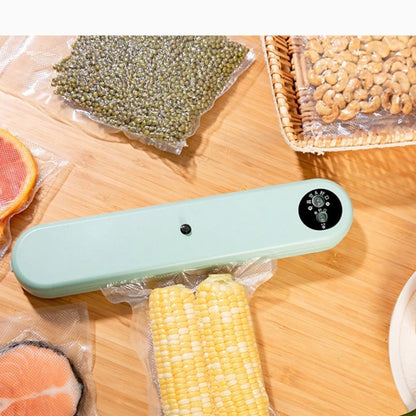 Green compact vacuum sealing machine, 32x7.5x5cm size, 110W power for food preservation with -50kPa pressure