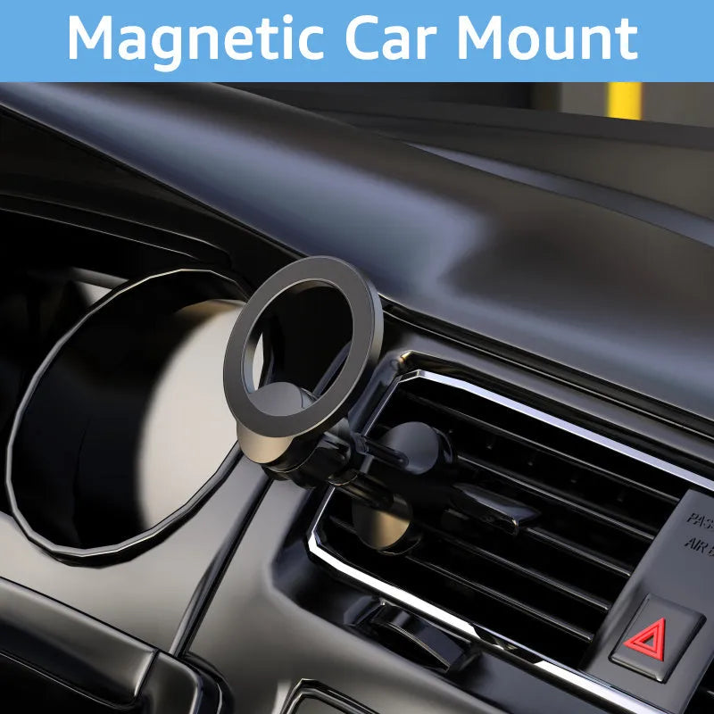 Black magnetic car phone holder clipped onto a car air vent, showing O-ring magnet and silicone grips.