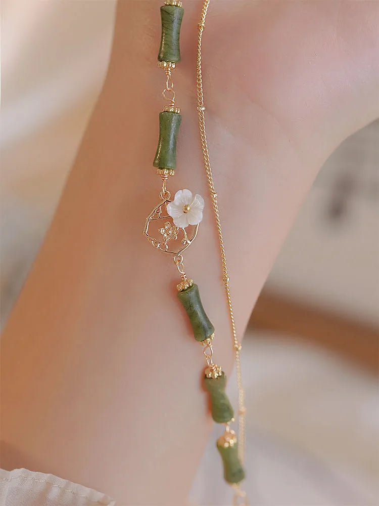 Natural olivine double layer bracelet with olive branch charms on wrist